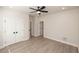 Bedroom with a ceiling fan, wood-look floors, ample closet space, and neutral paint at 275 Briscoe Way # 3, Alpharetta, GA 30009