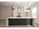 Modern kitchen featuring a large island, pendant lighting, and white cabinetry with stainless steel appliances at 275 Briscoe Way # 3, Alpharetta, GA 30009