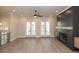 Bright living room with a fireplace, ceiling fan and double doors to the balcony at 275 Briscoe Way # 3, Alpharetta, GA 30009