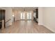 Spacious living room with fireplace, double doors and wood-look flooring at 275 Briscoe Way # 3, Alpharetta, GA 30009