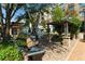 Modern metal sculpture nestled among trees and landscaped walkways in a community gathering space at 275 Briscoe Way # 3, Alpharetta, GA 30009
