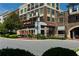 Superica restaurant's facade featuring orange umbrellas and red signage viewed from the street at 275 Briscoe Way # 3, Alpharetta, GA 30009