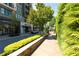 Landscaped street view with sidewalks, retail fronts, and lush greenery creating a vibrant atmosphere at 275 Briscoe Way # 3, Alpharetta, GA 30009