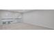 Open loft area with high ceilings and neutral walls, offering versatile space for various activities at 701 Bickmore Dr, Mcdonough, GA 30253