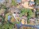 Aerial view of the house and neighborhood shows privacy and mature trees at 743 Cedar Sw Trce, Lilburn, GA 30047