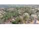 Picturesque aerial view of a suburban community with winding roads and plenty of trees surrounding the houses at 743 Cedar Sw Trce, Lilburn, GA 30047
