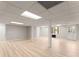 Large unfinished basement with light flooring and walk out doors at 743 Cedar Sw Trce, Lilburn, GA 30047