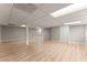 Unfinished basement with light flooring, columns and finished walls at 743 Cedar Sw Trce, Lilburn, GA 30047