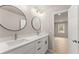 Bathroom boasts double sink vanity with modern faucets and fixtures and adjacent bedroom at 743 Cedar Sw Trce, Lilburn, GA 30047