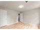 Bedroom features light-colored walls, flooring, and recessed lighting at 743 Cedar Sw Trce, Lilburn, GA 30047