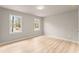 Bedroom filled with natural light, features two windows and hardwood floors at 743 Cedar Sw Trce, Lilburn, GA 30047