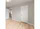 View of bedroom with neutral walls and floors and white painted doors at 743 Cedar Sw Trce, Lilburn, GA 30047