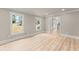 Bright and airy living room with hardwood floors, crown molding and neutral color palette at 743 Cedar Sw Trce, Lilburn, GA 30047