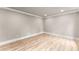 Bright and airy living room with hardwood floors, crown molding and neutral color palette at 743 Cedar Sw Trce, Lilburn, GA 30047