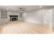 Bright living room with fireplace and built-in shelving leading to front entry at 743 Cedar Sw Trce, Lilburn, GA 30047