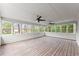 Enclosed sunroom with wood floors and many windows for natural light at 743 Cedar Sw Trce, Lilburn, GA 30047