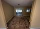 Living room with sliding glass doors and a window, offering access to an enclosed porch at 2813 Petersburg Ct, Decatur, GA 30034