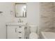 This bathroom features a white vanity, gray tile and a modern sink and mirror at 6350 Akins Way, Cumming, GA 30041