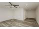 Spacious bedroom featuring new floors, a ceiling fan, and recessed lighting at 6350 Akins Way, Cumming, GA 30041