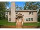 Charming two-story home with a welcoming front porch and well-maintained lawn at 6350 Akins Way, Cumming, GA 30041