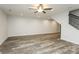 Spacious living room featuring recessed lighting, a ceiling fan, and new floors at 6350 Akins Way, Cumming, GA 30041