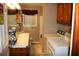 Bathroom with laundry, double windows, and linoleum floor at 7240 Colony Ln, Douglasville, GA 30135