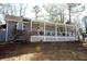 Charming ranch home with a covered porch and a well-maintained front yard at 7240 Colony Ln, Douglasville, GA 30135
