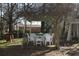 Cozy gazebo with white wicker furniture, perfect for outdoor relaxation and entertaining under a vine-covered roof at 7240 Colony Ln, Douglasville, GA 30135