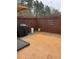 Backyard has a patio area, a wooden fence and a barbecue grill at 7248 Mountain Laurel Way, Stockbridge, GA 30281