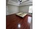 Spacious bedroom featuring a tray ceiling, hardwood floors, and natural light at 7248 Mountain Laurel Way, Stockbridge, GA 30281