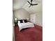 This primary bedroom has vaulted ceilings, neutral colored walls, and a ceiling fan at 7248 Mountain Laurel Way, Stockbridge, GA 30281