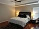 Bedroom with wood floors, tray ceilings, a ceiling fan and natural light from the window at 7248 Mountain Laurel Way, Stockbridge, GA 30281
