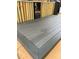 Close up of a gray composite deck featuring hidden fasteners and dark trim at 7248 Mountain Laurel Way, Stockbridge, GA 30281