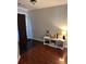 Cozy entryway featuring a dark door, white shelving, and a rich wood floor at 7248 Mountain Laurel Way, Stockbridge, GA 30281