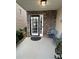 Charming front porch with stone accents, a decorative light, and comfortable seating at 7248 Mountain Laurel Way, Stockbridge, GA 30281