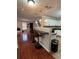 Spacious kitchen with bar top overlooking living area, and modern pendant lights at 7248 Mountain Laurel Way, Stockbridge, GA 30281