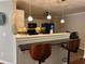 Modern kitchen with pendant lighting, white cabinets, and a breakfast bar with seating at 7248 Mountain Laurel Way, Stockbridge, GA 30281