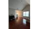 Open living room features hardwood floors and a vaulted ceiling with natural light at 7248 Mountain Laurel Way, Stockbridge, GA 30281