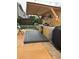 Outdoor kitchen complete with wooden floors, outdoor countertops, mini fridge and a covered roof at 7248 Mountain Laurel Way, Stockbridge, GA 30281