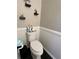 A powder room with updated wainscoting and decorative shelving at 7248 Mountain Laurel Way, Stockbridge, GA 30281