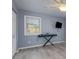 Light-filled bedroom with gray walls, a ceiling fan, and modern flooring, creating a serene atmosphere at 221 Shadowood Ln, Peachtree City, GA 30269