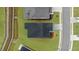 Aerial view showcasing the home's roof, driveway, and the meticulously maintained lawn and landscaping at 6451 Crest Brook Way, Buford, GA 30518
