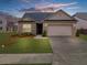 Charming single-story brick home with a well-maintained lawn and attached two-car garage at 6451 Crest Brook Way, Buford, GA 30518