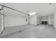 Large two-car garage offers plenty of space for vehicles and storage at 6451 Crest Brook Way, Buford, GA 30518