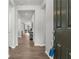 Bright, open hallway with hardwood floors leading to the living spaces and bedrooms at 6451 Crest Brook Way, Buford, GA 30518
