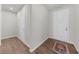 The hallway offers hardwood floors leading to a front door with sidelight windows and coat closet at 6451 Crest Brook Way, Buford, GA 30518