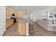 Kitchen and living area combo featuring a hard wood floors and modern appliances at 6451 Crest Brook Way, Buford, GA 30518
