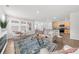 Open living area looking to kitchen with hard wood floors at 6451 Crest Brook Way, Buford, GA 30518