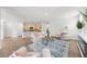 Spacious living area open to the kitchen, showcasing hardwood floors and ample seating at 6451 Crest Brook Way, Buford, GA 30518
