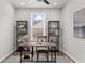 Bright home office featuring a modern desk, shelving, and a large window for natural light at 6451 Crest Brook Way, Buford, GA 30518